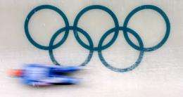 A competitor speeds down the course during the group A men's singles Luge practice session