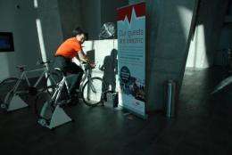 A guest pedals on a bike inside the eco-friendly Crowne Plaza Hotel in Copenhagen