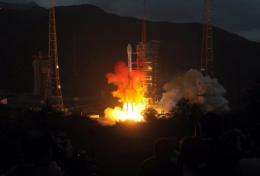A Long March 3C rocket carrying the Chang'e-2 probe  blasts off from the launch centre in Xichang, China