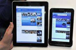 An Apple iPad displayed next to Samsung's new tablet device, the "Galaxy Tab"