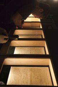 An employee prepares an exhibition showcasing the original manuscript of Albert Einstein's General Theory of Relativity