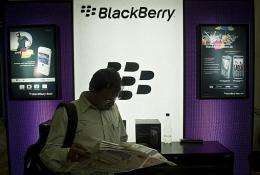 An Indian customer waits next to a BlackBerry display at a shop in New Delhi