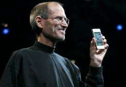 Apple chief executive Steve Jobs holds the iPhone 4