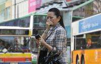 A resident covers her nose over pollution in Hong Kong