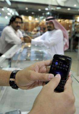 A Saudi Arabian man checks his BlackBerry at a store in the Red Sea coastal city of Jeddah
