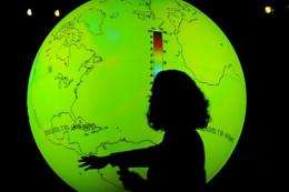 A scientist stands in front of a globe during the United Nations Climate Change Conference in Copenhagen in 2009