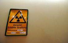 A sign reading "Caution! Increased Radiation", is fixed on a wall of the nuclear power station in Gundremmingen, Germany