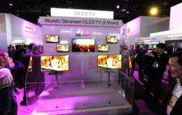 Attendees view LG Oled 2.9mm thin televisions at the 2011 International Consumer Electronics Show (CES) in Las Vegas