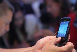 A user tries out the new Blackberry Torch 9800 smartphone
