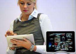 A woman tries out an iPad