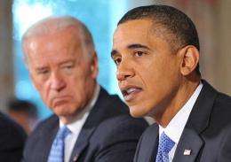 Barack Obama (R) speaks during a meeting to discuss energy policy as Joe Biden (L) looks on
