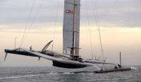 BMW Oracle racing's giant trimaran sails during a training session off Valencia's coast
