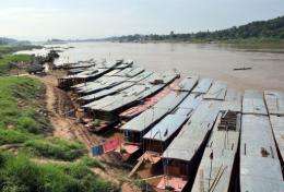 Boats lined up along the Mekong River in Laos