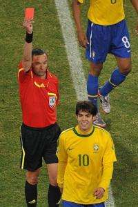 Brazil's midfielder Kaka reacts as he is sent off by French referee Stephane Lannoy (back)