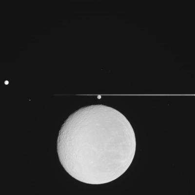 Cassini captures Rhea coming down 		 	