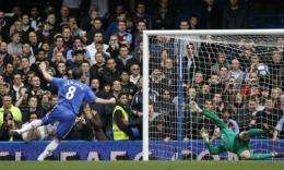 Chelsea's Frank Lampard (left) scores a penalty shot past Aston Villa's goalkeeper Brad Friedel