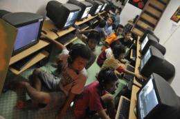 Children play computer games in downtown Jakarta