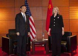 China assures Clinton on rare earth exports (AP)