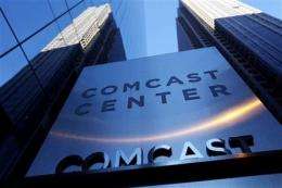 Comcast 2Q profit dips on NBC Universal deal costs (AP)