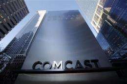 Comcast 4Q profit up on revenue boost, tax gain (AP)
