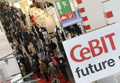 Fair visitors crowd the halls of the world's biggest high-tech fair, the CeBIT in Hanover, in 2010