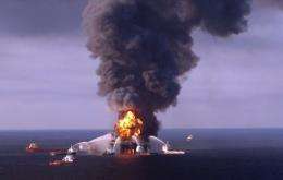 Fiire boat response crews battle the blazing remnants of the offshore oil rig Deepwater Horizon