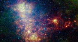 Galaxy Exposes Its Dusty Inner Workings in New Spitzer Image
