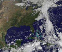 GOES-13 sees an unholy matrimony: Nicole and low pressure swamp the US East Coast