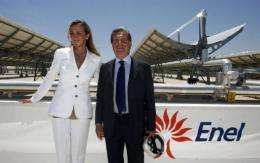 Italian Environment Minister Stefania Prestigiacomo (L) poses with Enel company general director Fulvio Conti