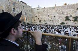 Jewish pilgrims pray at the Wailing Wall