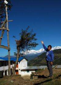 Mahabir Pun points to an antenna he set up in the village of Nagi in 2002