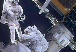 NASA astronauts Steve Bowen (L) and Mike Good during a spacewalk
