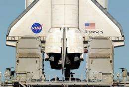 NASA postponed until mid-December the launch of the space shuttle Discovery