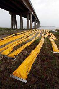 Oil containment booms are seen staged at the edge of Lake Pontchartrain near the Rigolets in New Orleans