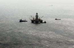 Oil sheen is seen with vessels assisting near the source of the BP Deepwater Horizon oil spill