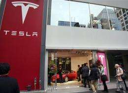 Panasonic invests $30M in electric car maker Tesla (AP)