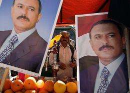 Pictures of Yemeni President Ali Abdullah Saleh decorate the stall of a juice vendor during a pro-regime protest