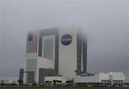 Rain, overcast sky delay space shuttle's return (AP)