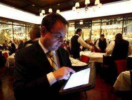 Restaurants uploading menus on iPads for diners (AP)