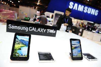 Samsung staff set up the display for the Samsung Galaxy Tab for the International Consumer Electronics Show in Las Vegas