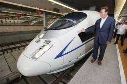 Schwarzenegger checks out China's high-speed rail (AP)