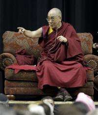 Scientist inspired by Dalai Lama studies happiness (AP)