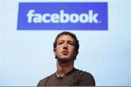 SEC rule likely to trigger Facebook IPO in 2012 (AP)