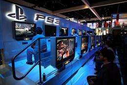 Showgoers try out games at a PlayStation 3 exhibit