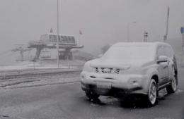 Snow and ice covering buildings and cars at Mount Hotham as snow fell in Australia