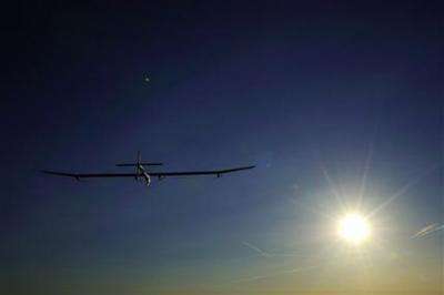 Solar plane lands after completing 24-hour flight (AP)