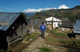 Teacher and IT specialist Mahabir Pun walks in the village of Nagi, some 200 kms west of Kathmandu