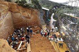 Workers carry out an excavation at the Atapuerca archaeology site in July