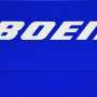 Boeing reports big loss, hints